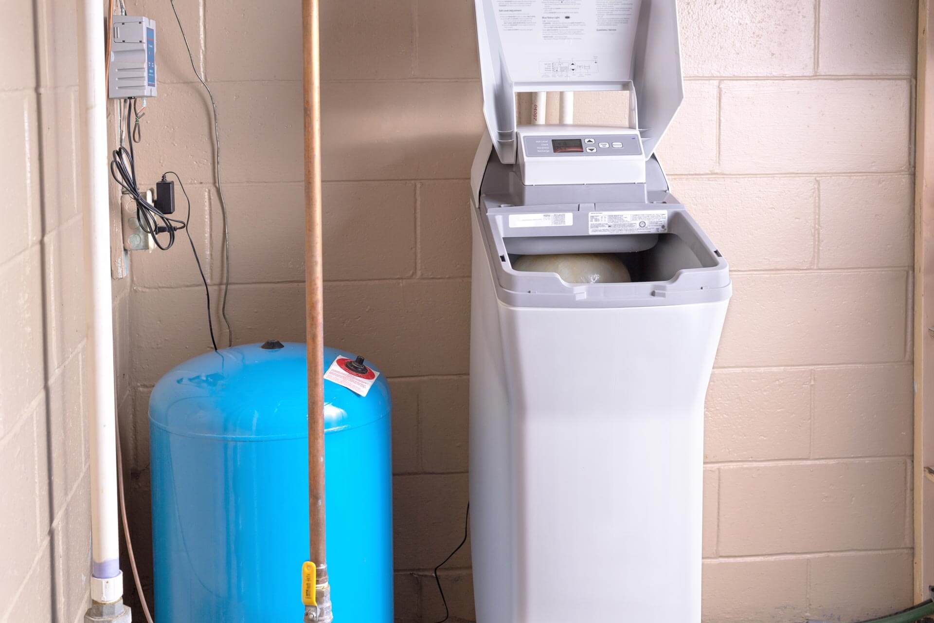 Photo of a water softener unit installed in a building - Carolina Heating Service Inc. Photo of a water softener unit installed in a building